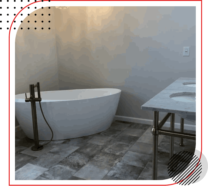 An image of a bathroom with a bathtub and sink.
