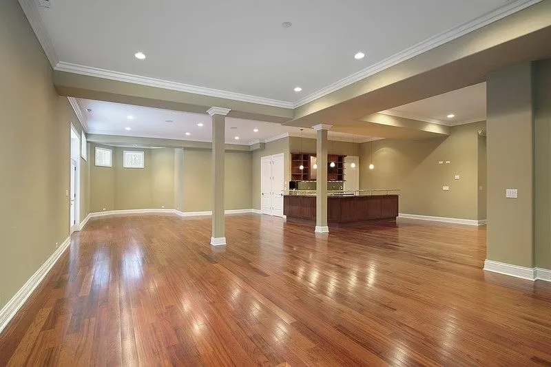 A large room with hardwood flooring.
